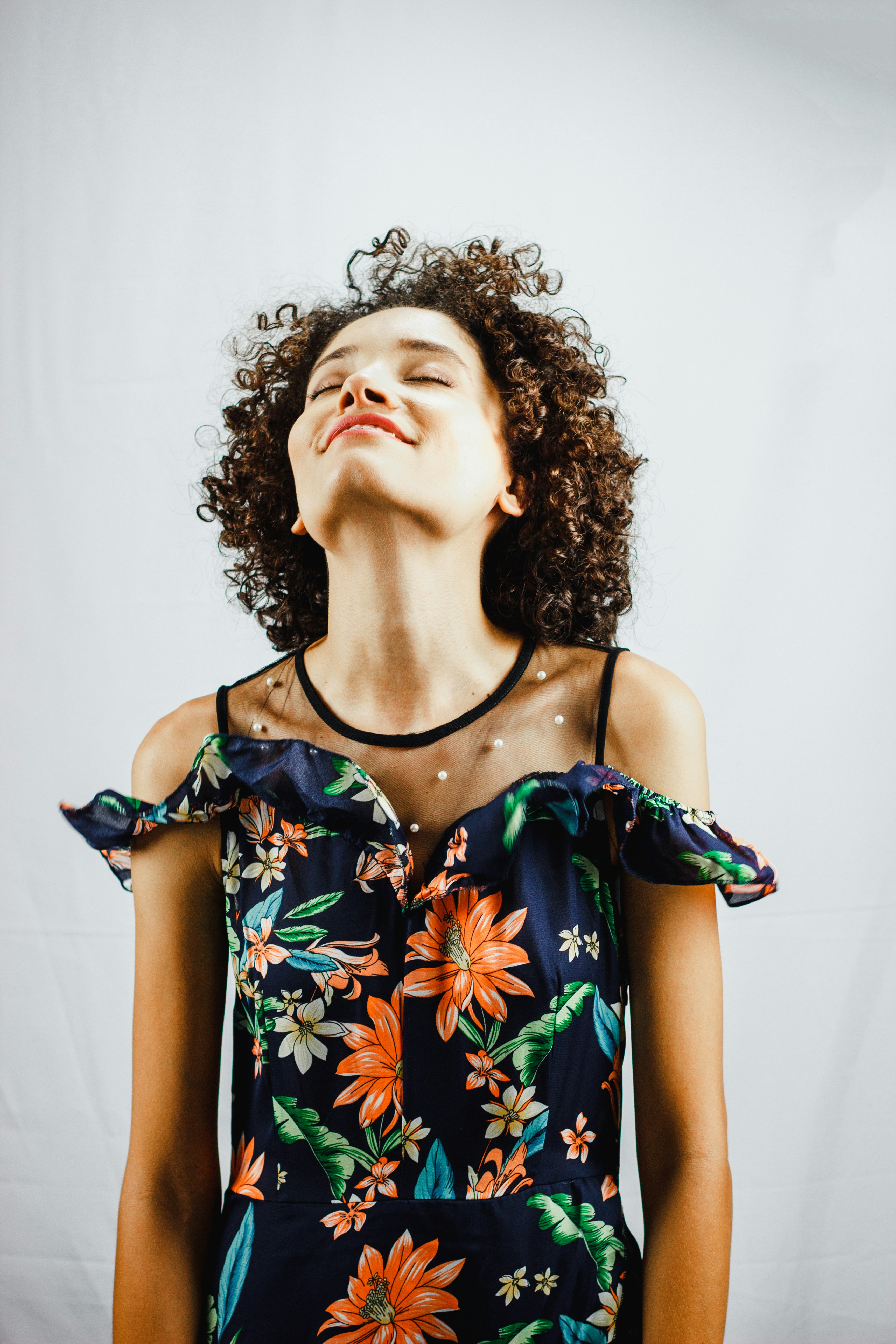 woman smiling while looking upwards